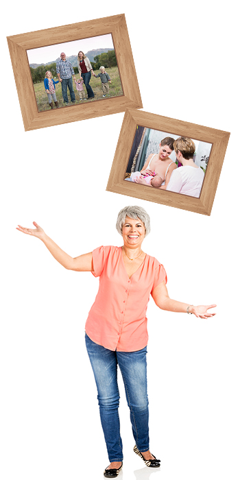 Woman juggling framed photos of family and clients